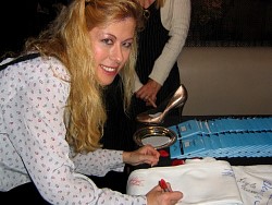 josie roman signing wizard jeans for charity.jpg