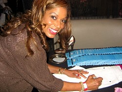 rolonda watts signing wizard jeans for charity.jpg