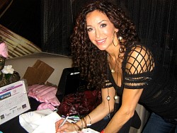 sofia milos signing wizard jeans for charity.jpg